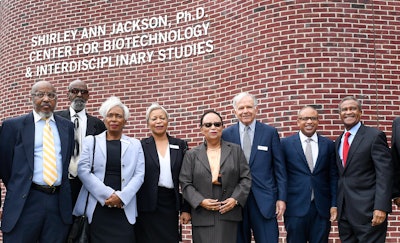 Dr. Shirley Ann Jackson stands (center) in front of her namesake Center for Biotechnology & Interdisciplinary Studies at RPI.