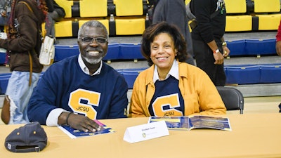 Clarence D. Armbrister, president of Johnson C. Smith University, enjoys a Golden Bulls basketball game in Brayboy Gymnasium (home of “Brayboy Madness”) with First Lady Denise McGregor Armbrister.