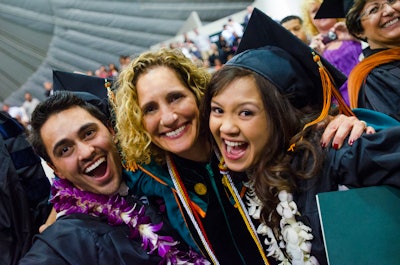 University of La Verne President Dr. Devorah Lieberman is shown with graduating students in 2013.