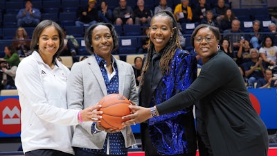 University of California, Berkeley, Head Women’s Basketball Coach Charmin Smith, second from left, hosts the annual Raising the B.A.R. Invitational to promote social justice and equity.