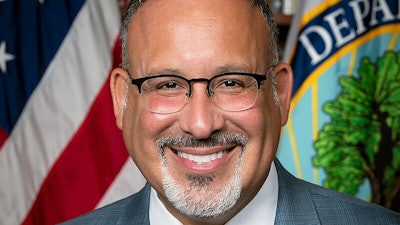 Dr. Miguel Cardona