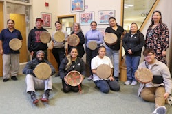 Group photo with completed projects at Drum Making Workshop hosted by Ojibwemowining Digital Arts Studio at FDLTCC