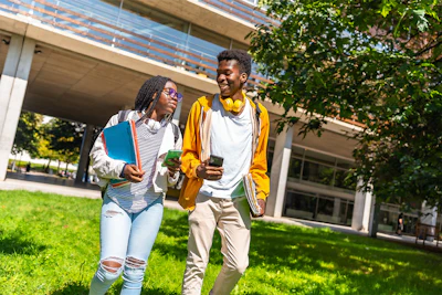 Two Students Walking Outside Campus 1200x800 1